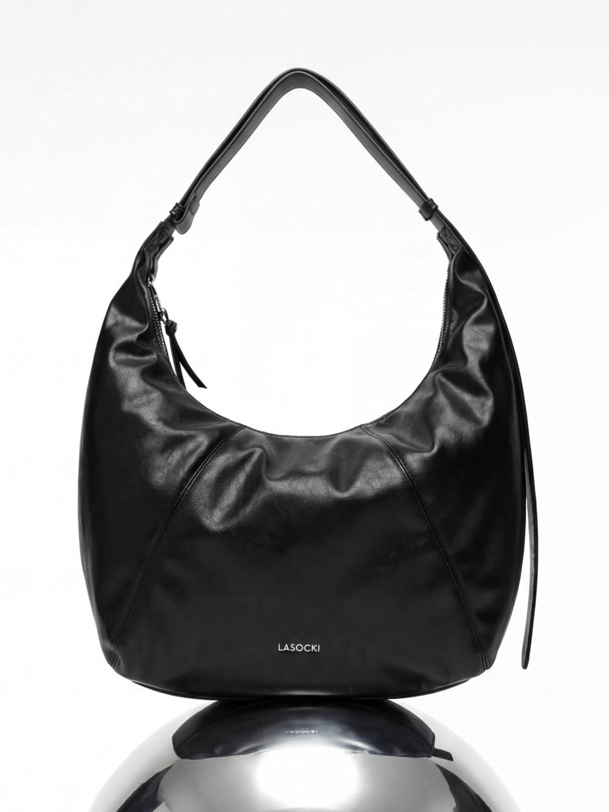 Black leather hobo bag on a chrome sphere