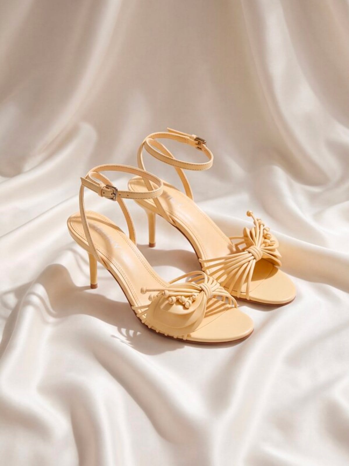 Vanilla stiletto sandals on cream satin